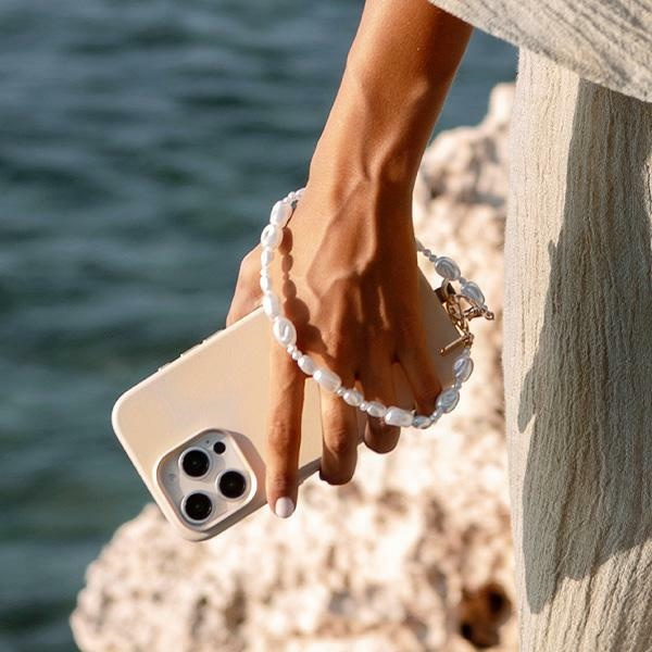 UNIQ Coehl Perla Handstrap uniwersalny   sznurek do telefonu na rękę biały/white pearl